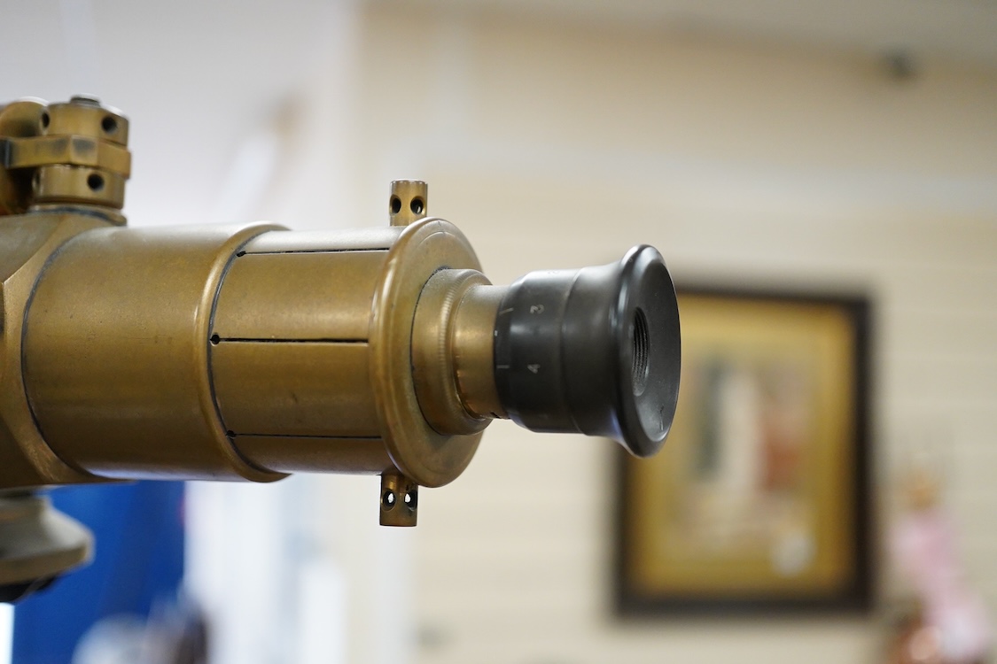 An early 20th century surveyor’s brass theodolite by Stanley, Holborn, London, serial number 27108, on original brass mounted tripod with oak legs, overall height 170cm